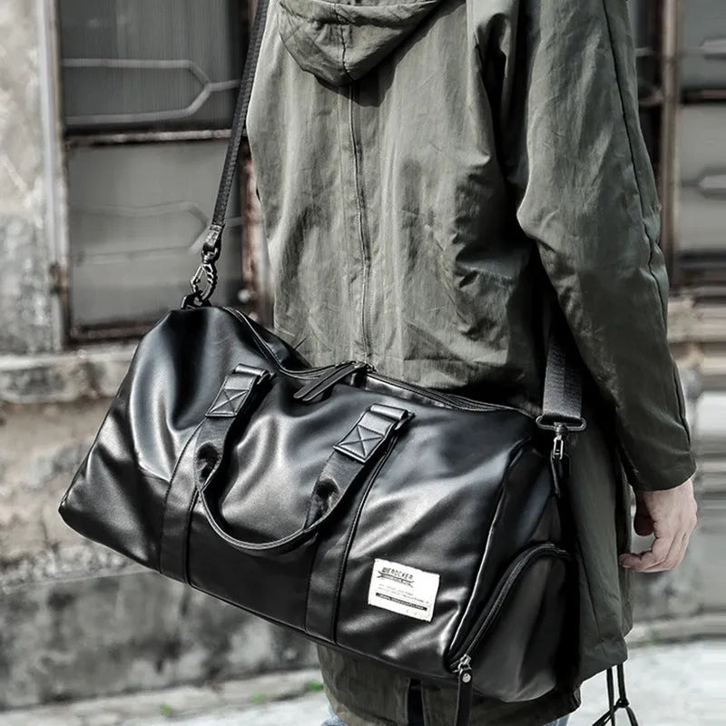 Black large capacity sports training bag with waterproof PU leather, showing handle and zipper details for gym and travel use