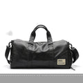 Black large capacity sports training bag with waterproof PU leather, showing handle and zipper details for gym and travel use