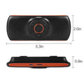 Orange plastic Bluetooth car hands-free kit designed for sun visor mounting.