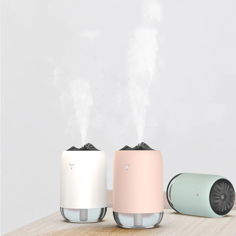 Magic Flame humidifier columnar aroma diffuser in white, blue, or pink with USB cable