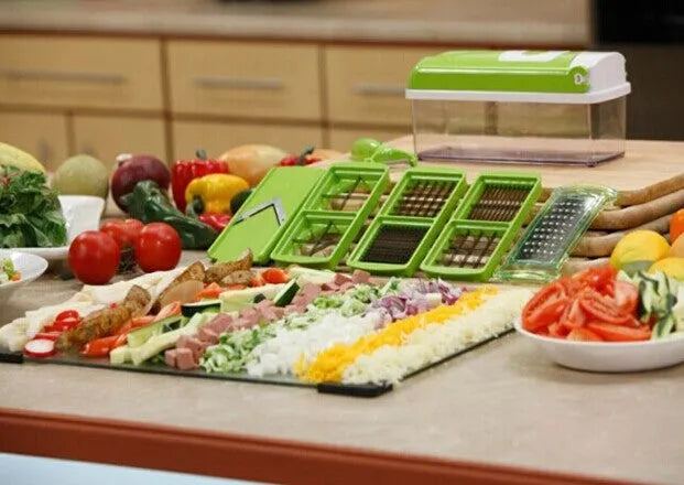 Green 12-piece manual vegetable chopper set with stainless steel blades and multiple attachments