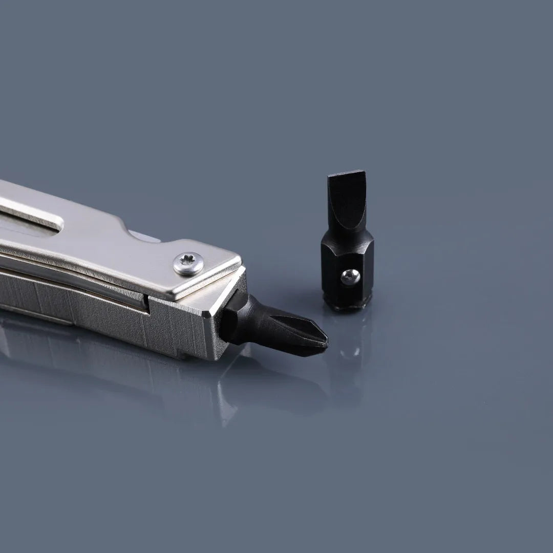 White stainless steel multi-function tool with wrench, knife and needle nose pliers functions