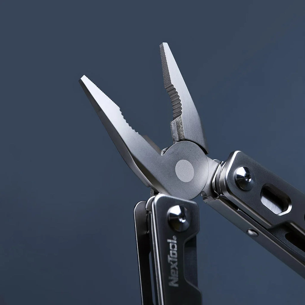 White stainless steel multi-function tool with wrench, knife and needle nose pliers functions