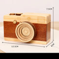 Camera-shaped wooden music box with rotating mechanism on pine wood base