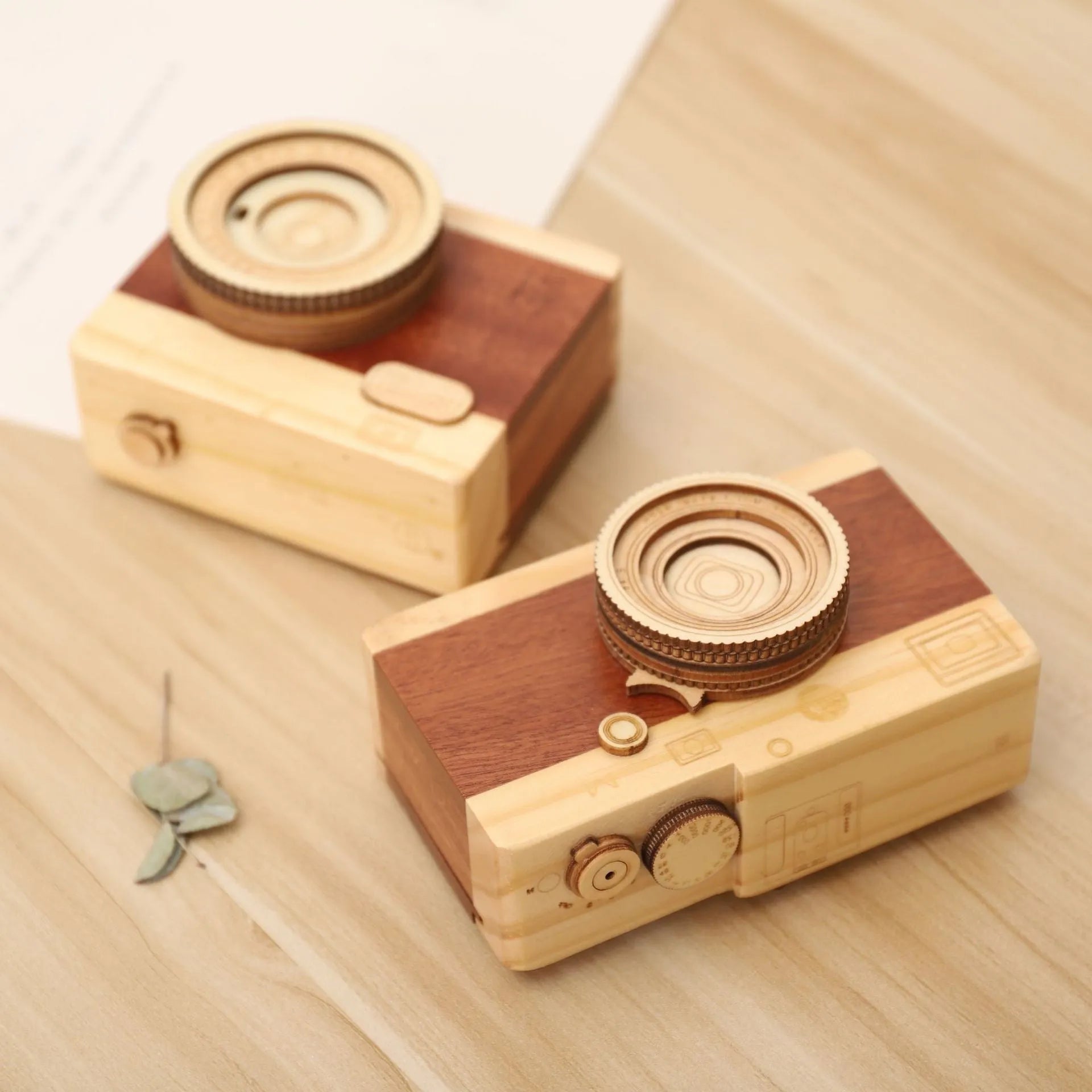 Camera-shaped wooden music box with rotating mechanism on pine wood base