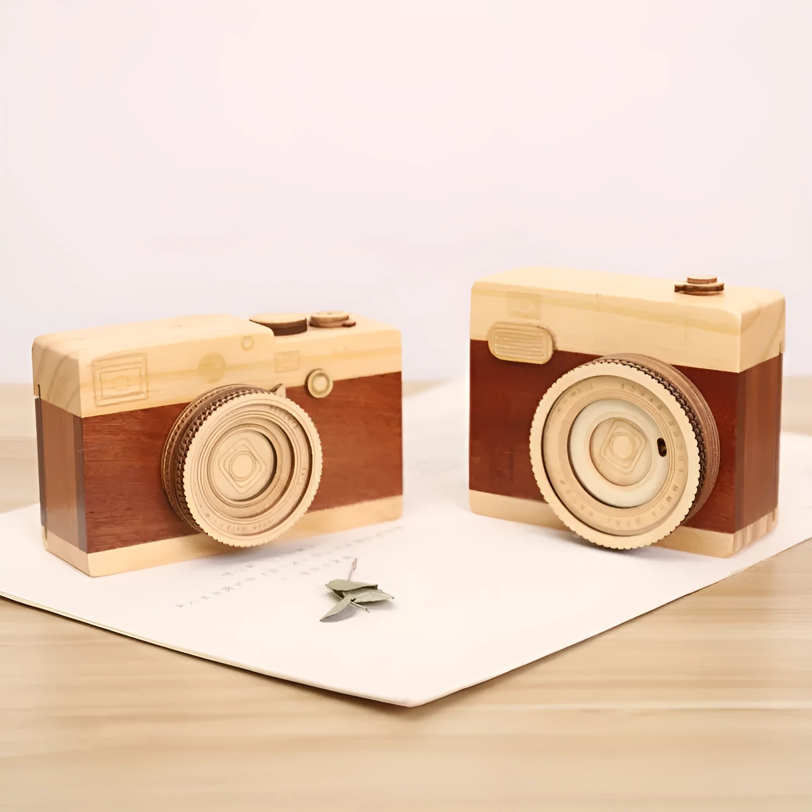 Camera-shaped wooden music box with rotating mechanism on pine wood base