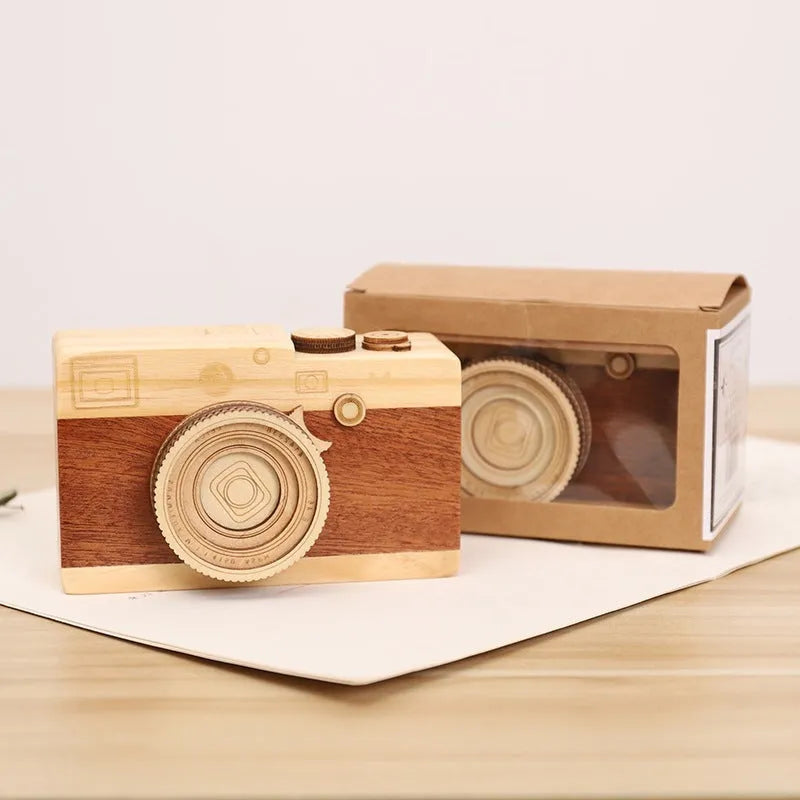 Camera-shaped wooden music box with rotating mechanism on pine wood base