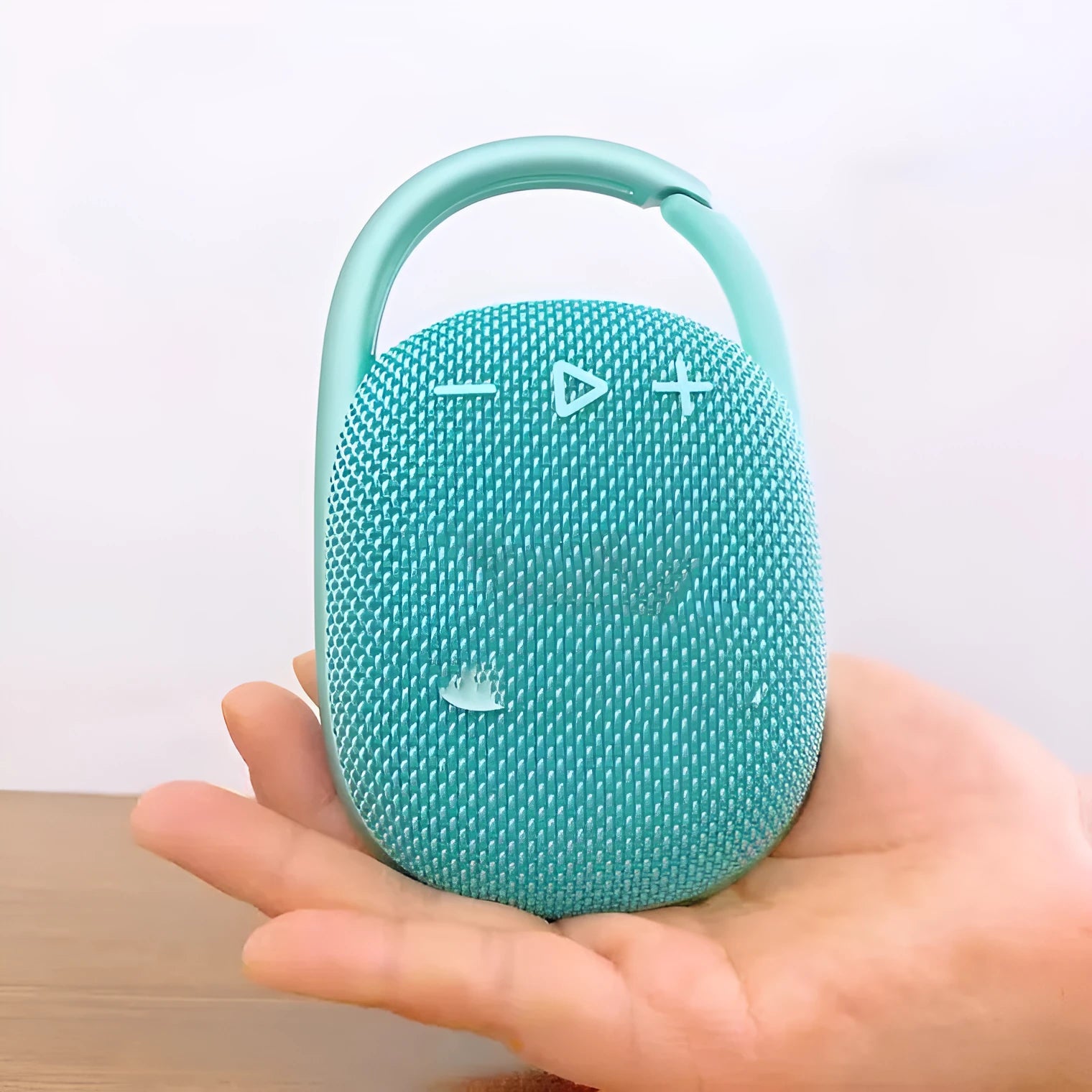 Small portable Bluetooth speaker in one of six colours: black, blue, green, pink, red, or silver grey.