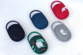 Small portable Bluetooth speaker in one of six colours: black, blue, green, pink, red, or silver grey.