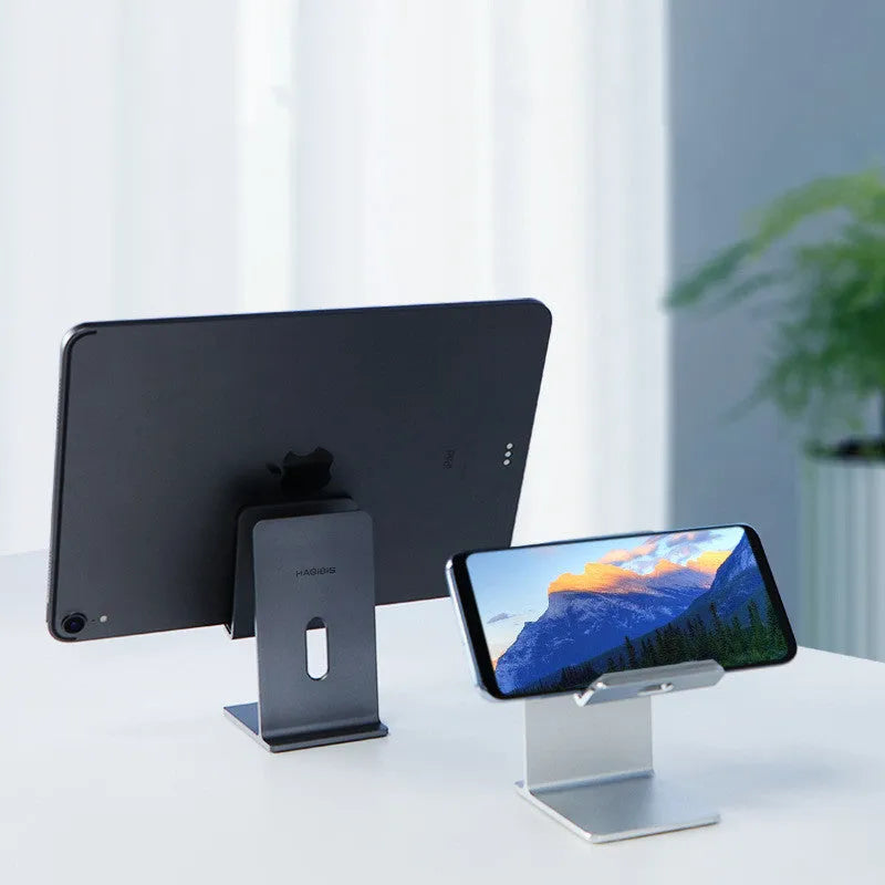 Alloy metal mobile phone holder for desktop use in grey or silver.