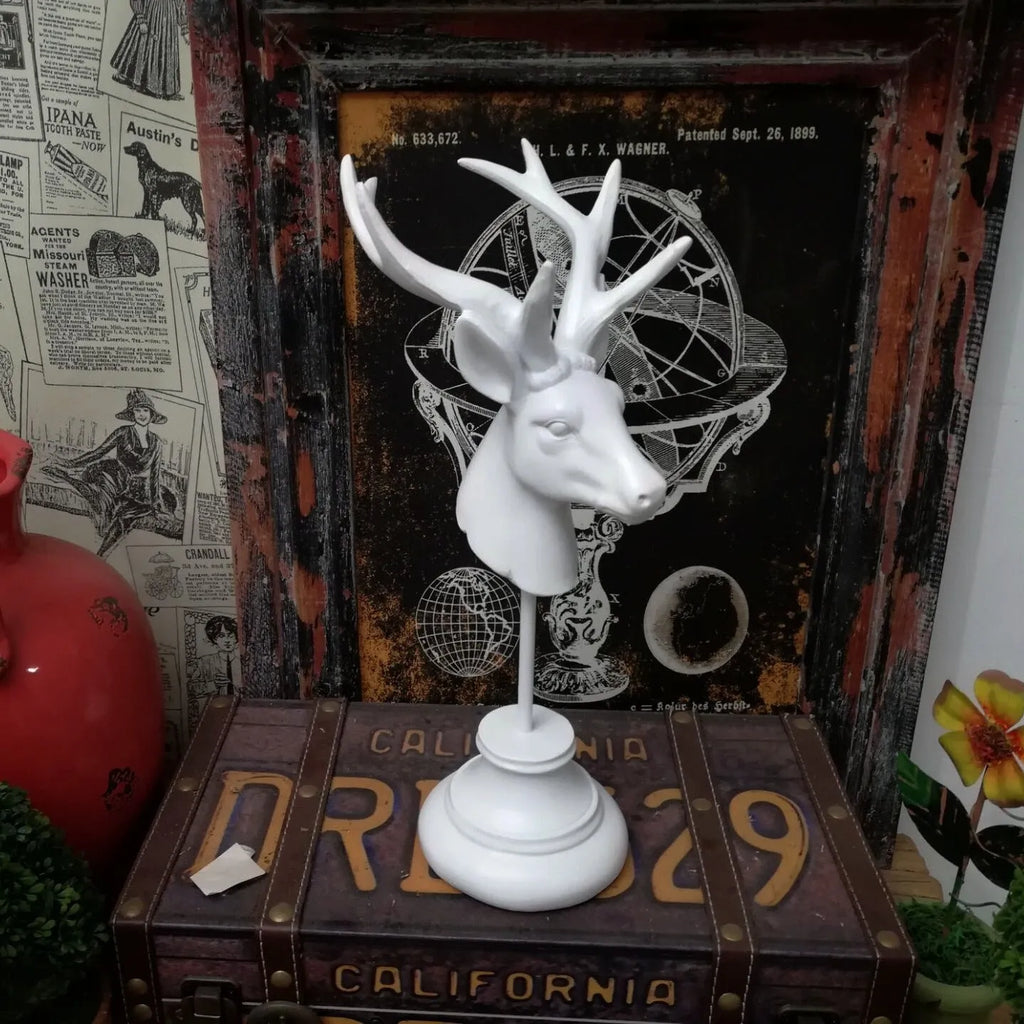 Natural resin animal sculpture home decoration in black, white, or wood colour, 32cm tall.