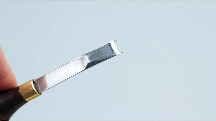 Sectional cutting wide shovel edge thinning knife drum shovel with leather sheath for knife sharpening.