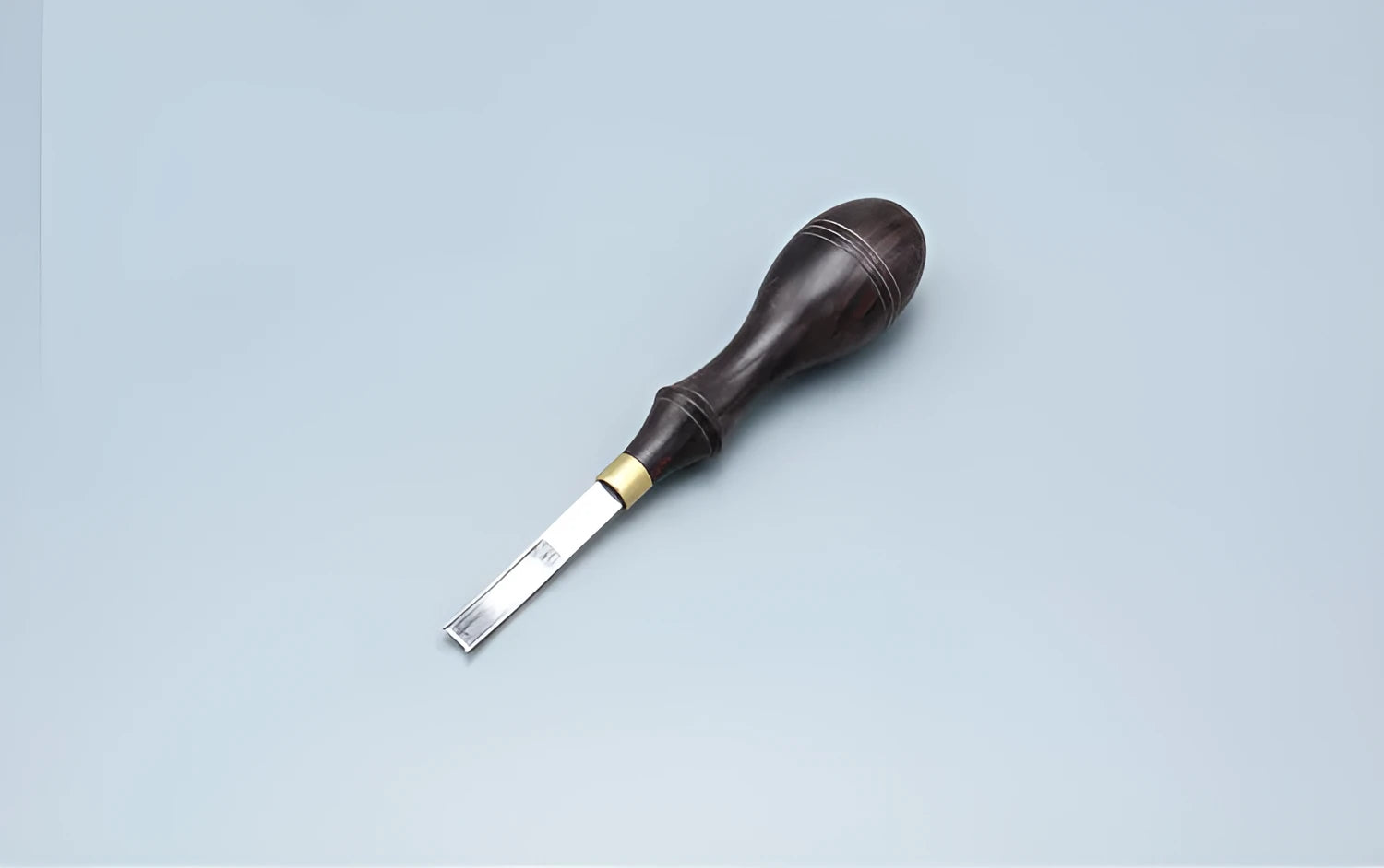 Sectional cutting wide shovel edge thinning knife drum shovel with leather sheath for knife sharpening.