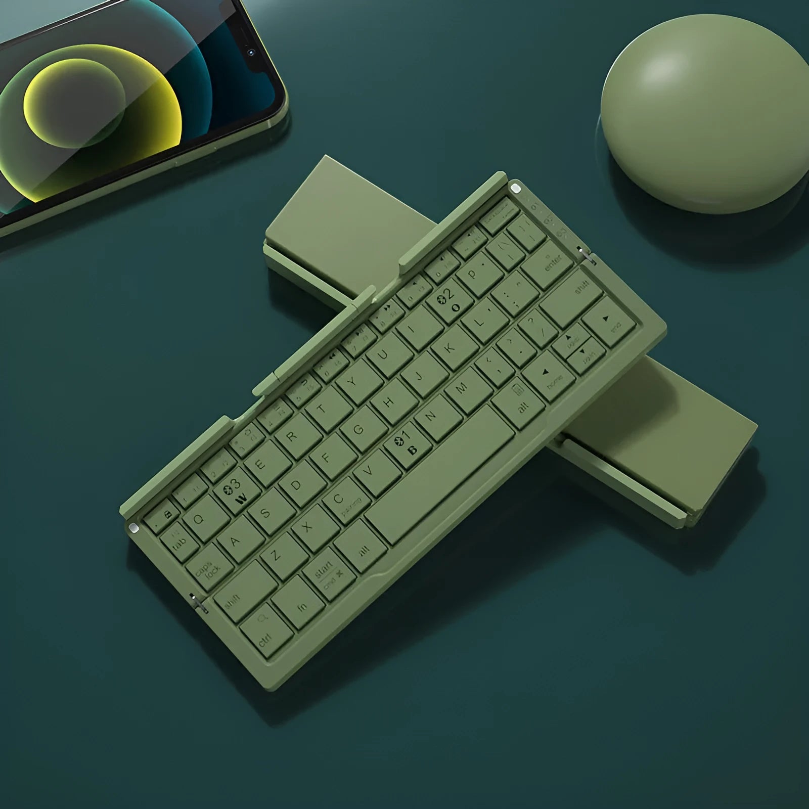 Silver white folding Bluetooth keyboard propping up smartphone with aluminium alloy housing