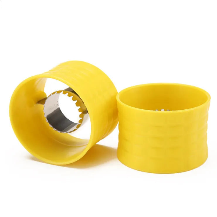 Yellow corn-shaped manual corn grinder thresher kitchen gadget on a wooden surface