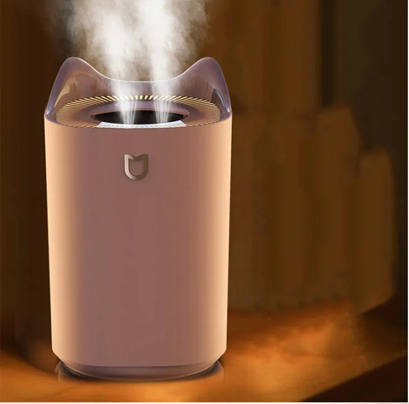 USB-powered double spray humidifier with three fog outlets in coral pink or white colour