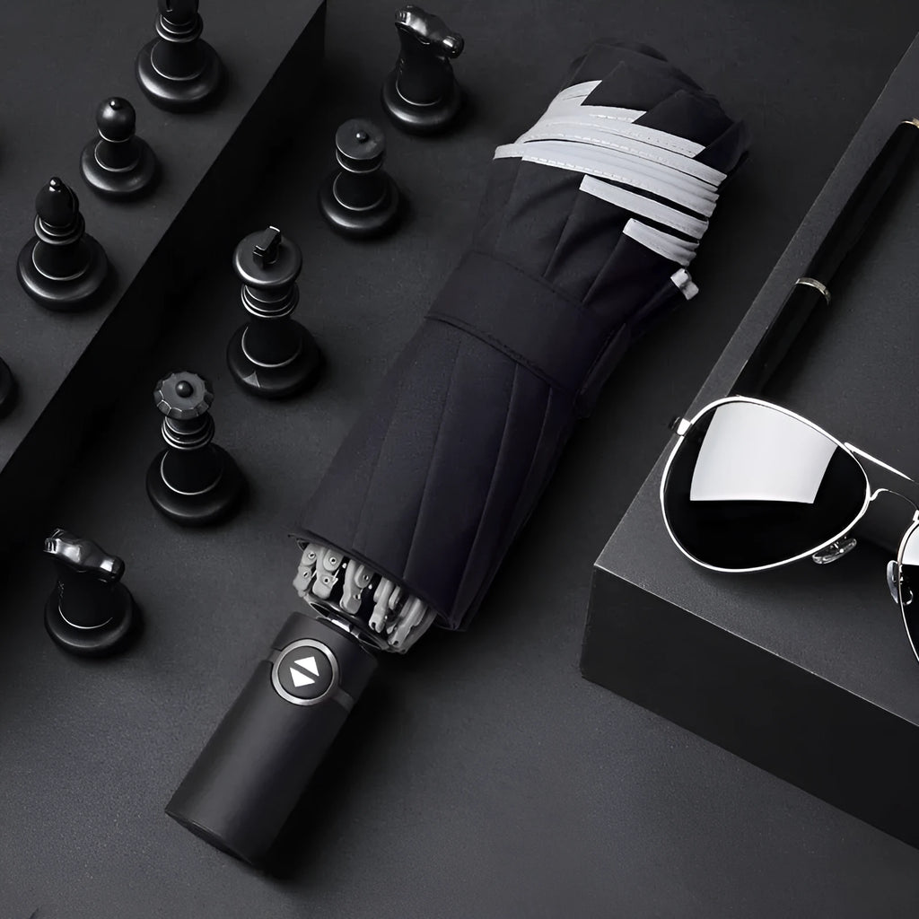Black automatic reverse umbrella with reflective cloth, showing plastic non-slip handle and three-fold design