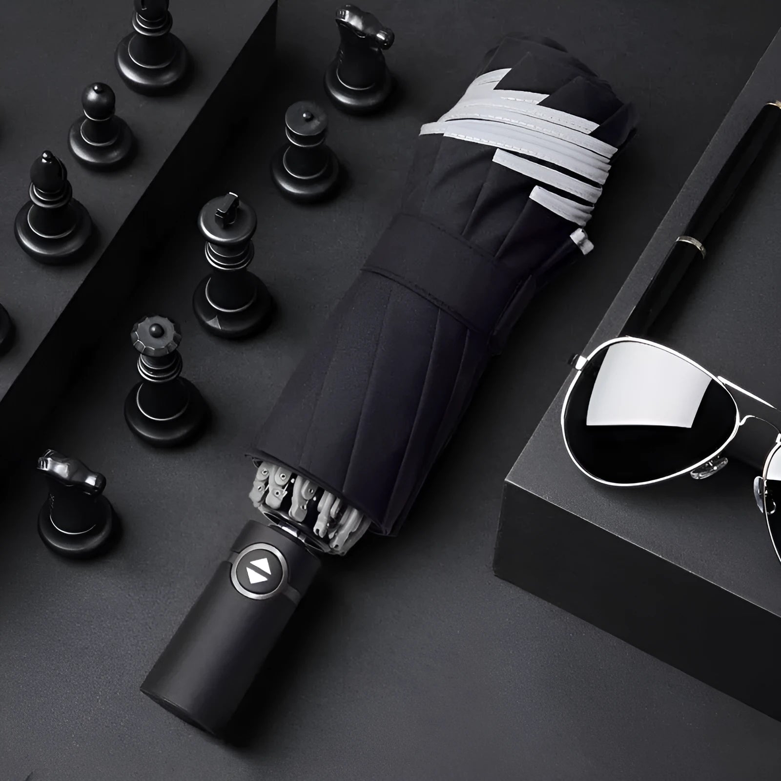 Black automatic reverse umbrella with reflective cloth, showing plastic non-slip handle and three-fold design