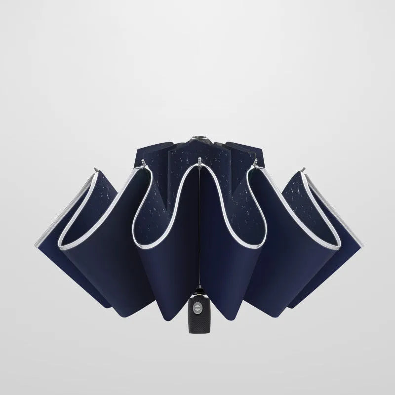 Black automatic reverse umbrella with reflective cloth, showing plastic non-slip handle and three-fold design