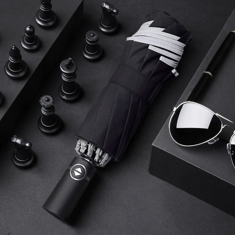 Black automatic reverse umbrella with reflective cloth, showing plastic non-slip handle and three-fold design