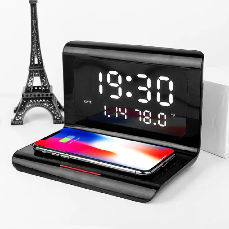 White wireless charging alarm clock showing time, date, temperature and calendar display on bedside table