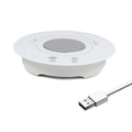 Black USB-powered hot and cold coaster for drinks on a desk next to a coffee cup.