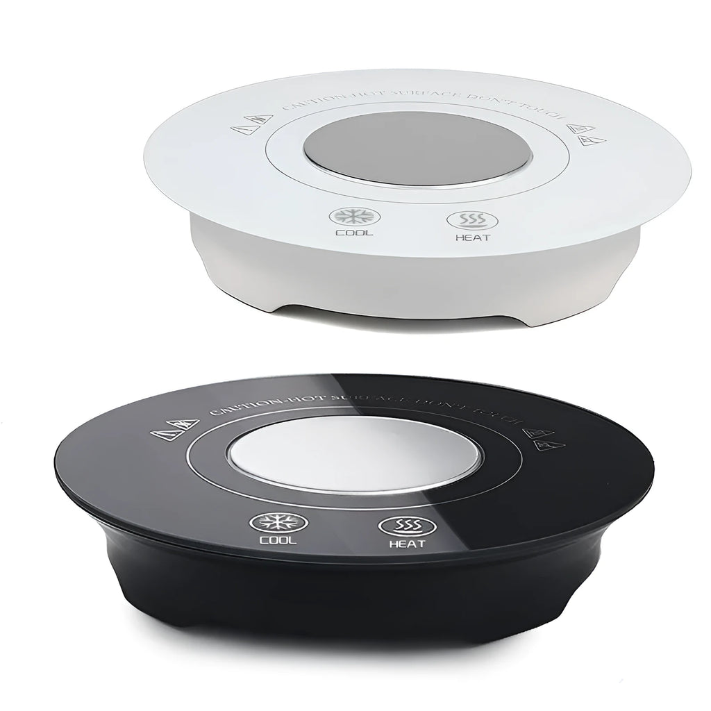 Black USB-powered hot and cold coaster for drinks on a desk next to a coffee cup.