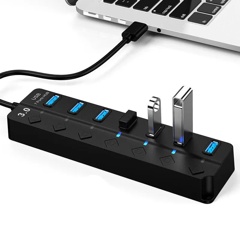 Black seven-port USB 3.0 hub with external power supply and cables