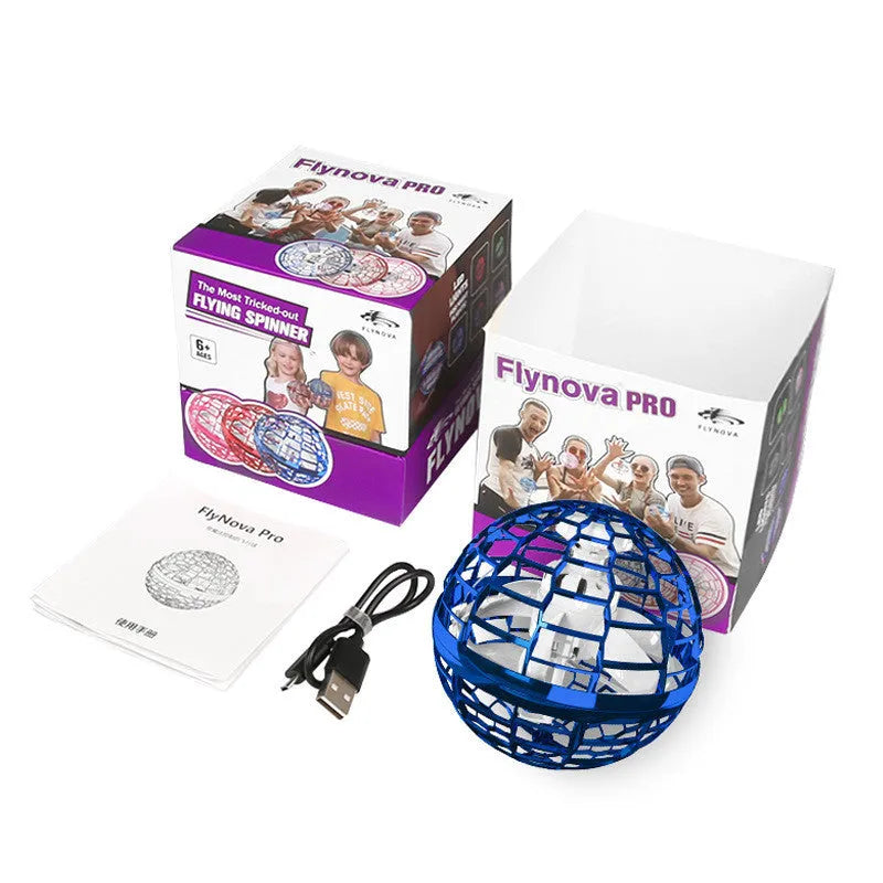 Soft blue spinning flying ball toy with LED lights hovering above a child's hand next to a magic wand.