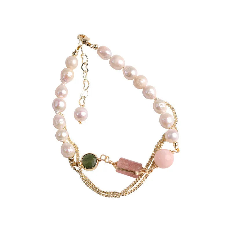 Women's freshwater pearl bracelet with strawberry quartz crystal charms in geometric wire wrap design