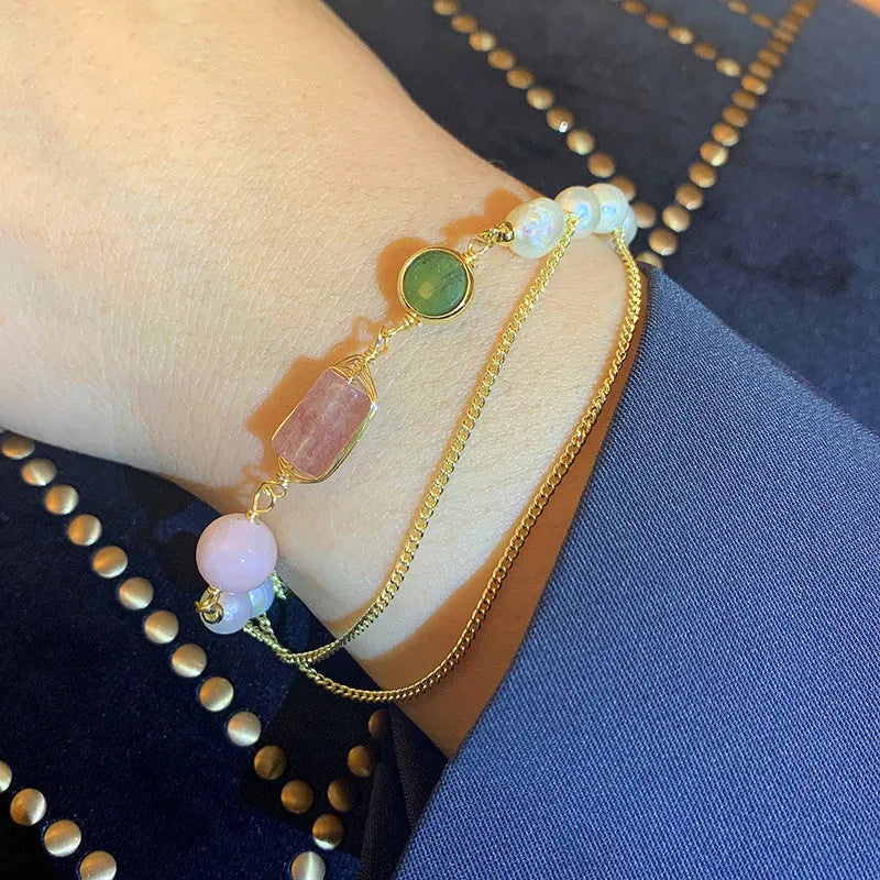 Women's freshwater pearl bracelet with strawberry quartz crystal charms in geometric wire wrap design