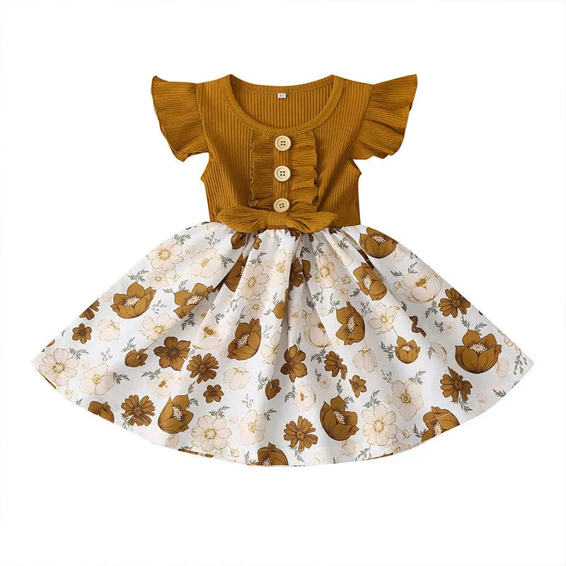 Sleeveless summer dress for a toddler girl on a hanger, shown in a green colour.