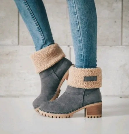 Women's mid-tube suede snow boots in black with a thick heel and waterproof platform.