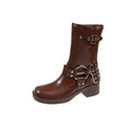 Women's black platform boots with a large silver belt buckle and mid-calf height.