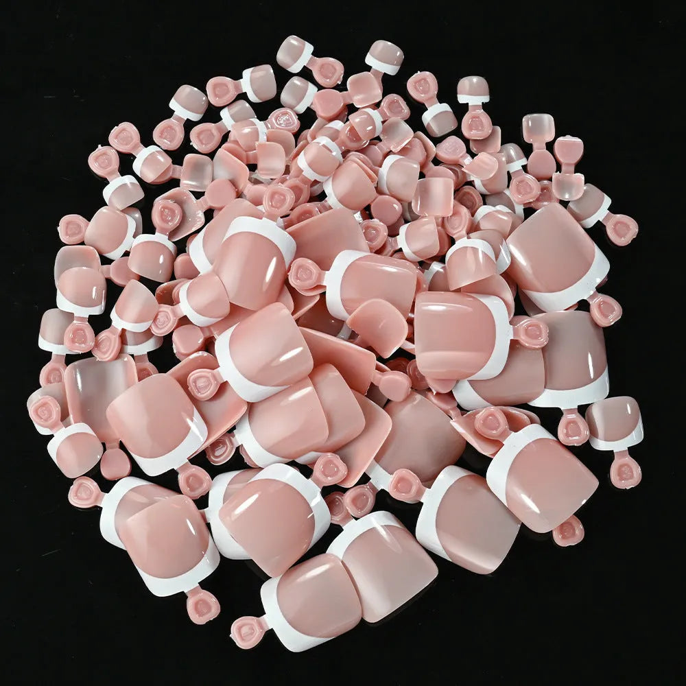 Open box showing 120 French style toe nail pieces with white tips in various nude colours.