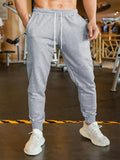 Men's loose-fit casual trousers with elastic lace waistband in a choice of three colours.