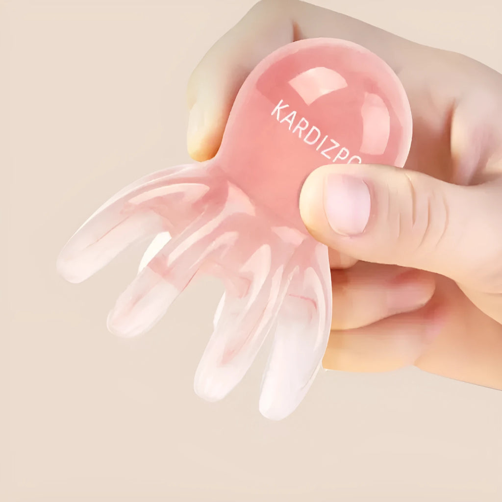 Pink octopus-shaped periocular meridian massage comb made from natural resin with storage bag