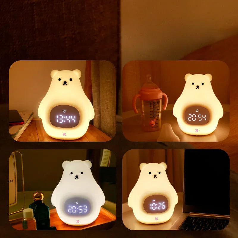 White silicone cartoon bear night light with remote control on a table.