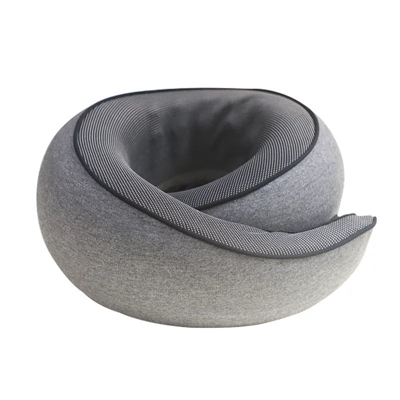 Dark grey U-shaped memory foam neck pillow shown with its storage bag.