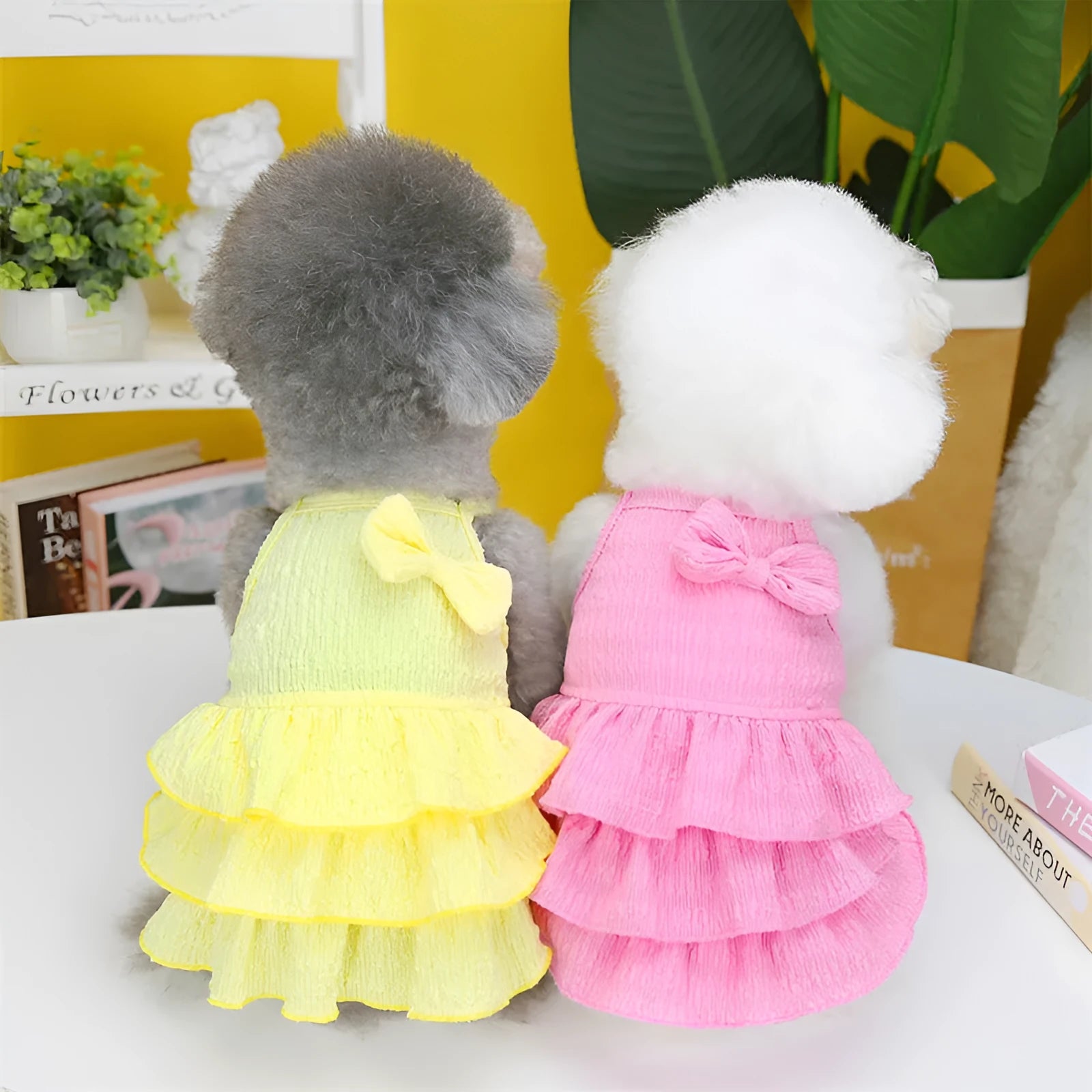 Small dog wearing polyester princess dress with layered candy skirt in rose red colour