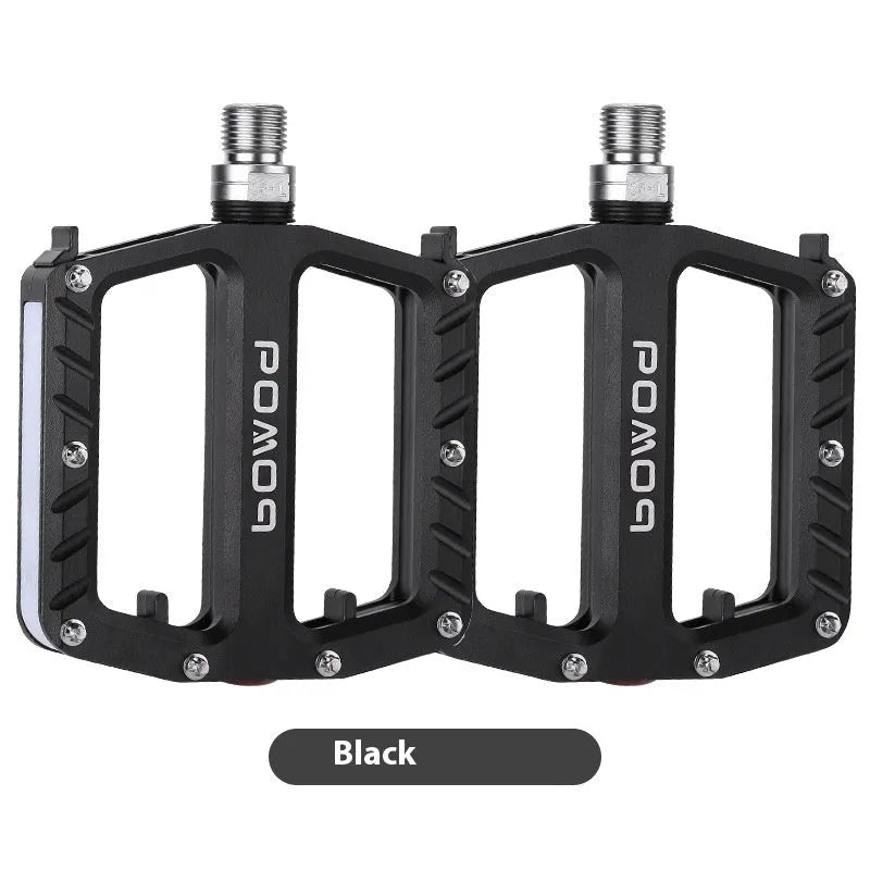 Pair of aluminium alloy bicycle pedals with integrated LED lights in a choice of colours.