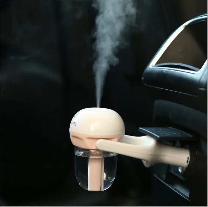 Blue portable car humidifier air purifier with 180 degree rotation on car dashboard