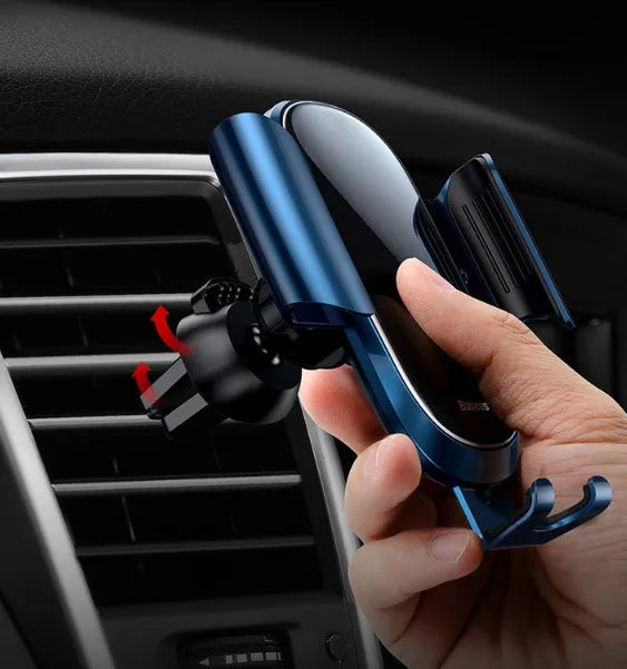 Universal smart car bracket in black mounted on a car dashboard holding a smartphone