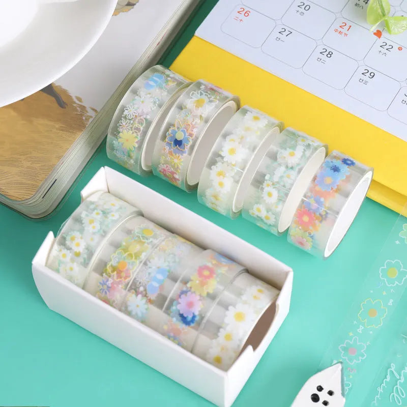 Five rolls of Midsummer Daisy coloured decorative adhesive tape with cartoon design on transparent PET base.