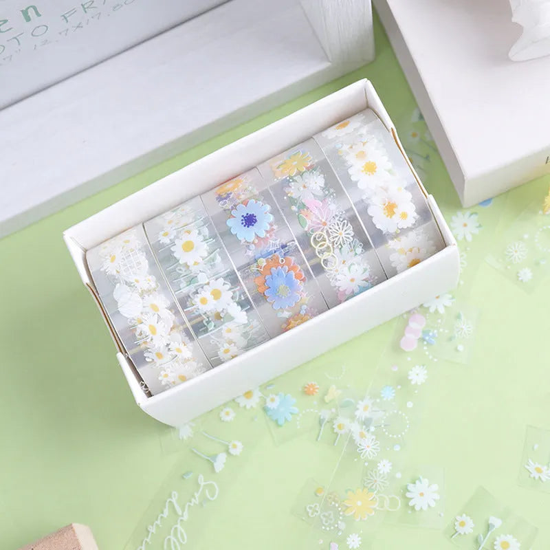 Five rolls of Midsummer Daisy coloured decorative adhesive tape with cartoon design on transparent PET base.