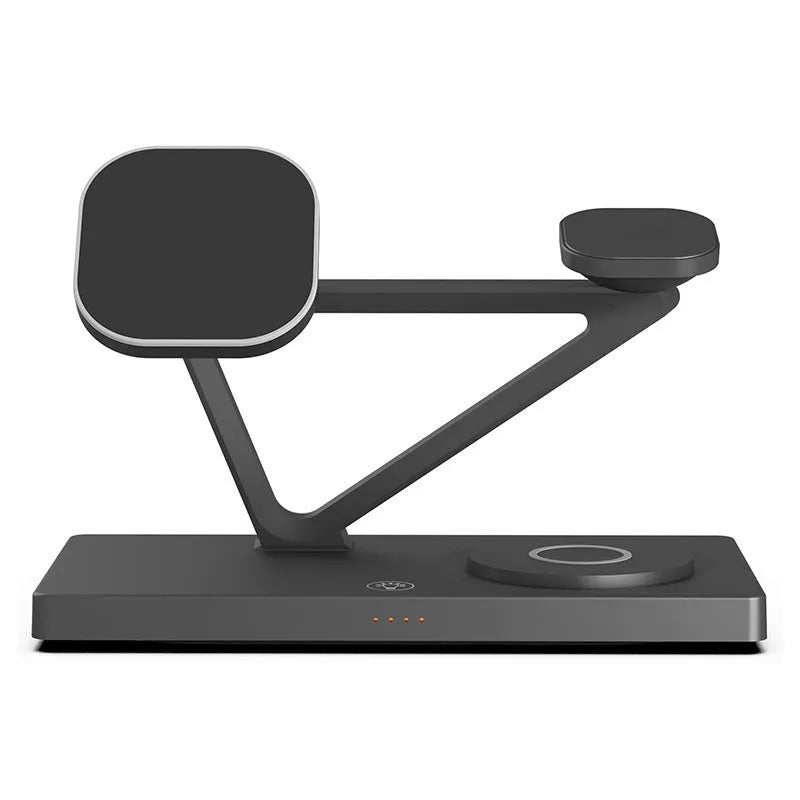 White 5-in-1 wireless charging station with magnetic phone holder, smartwatch pad, and glowing RGB night light on a wooden desk.