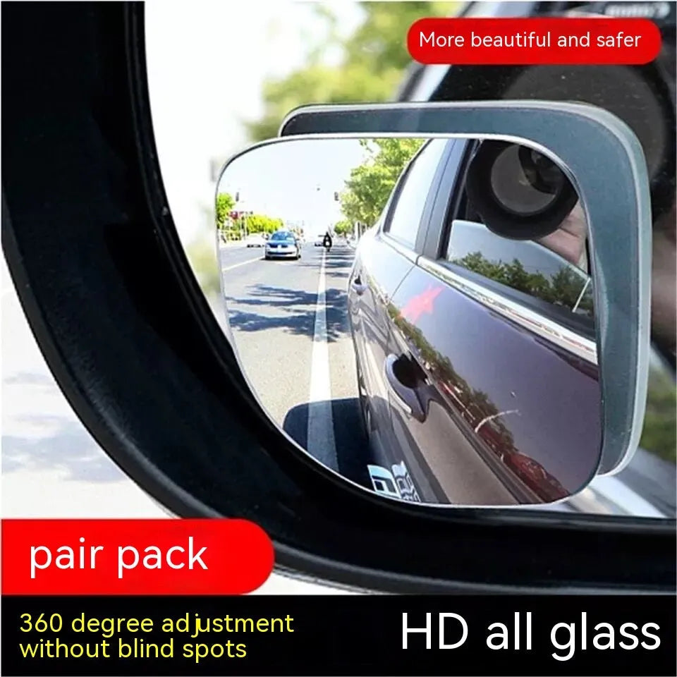 White fan-shaped car blind spot mirror with 360-degree adjustable mount on a universal bracket.