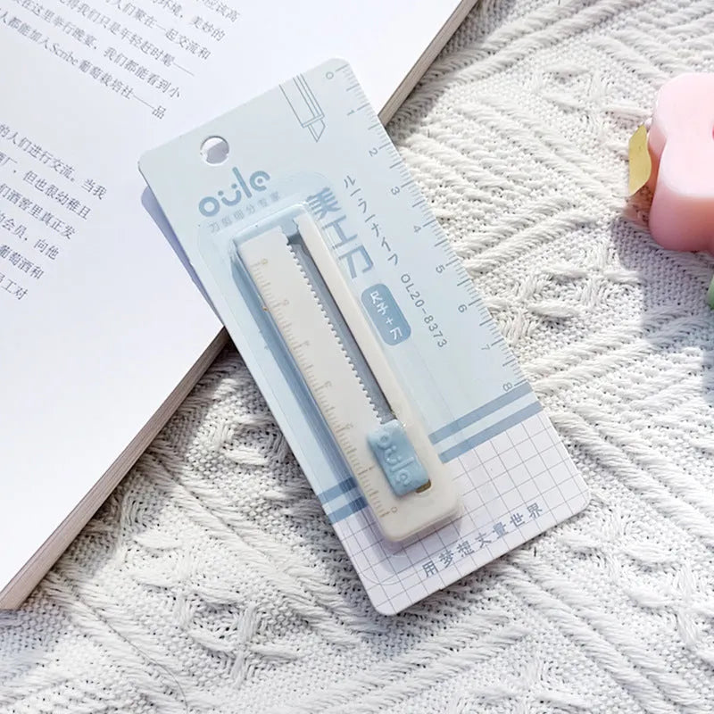 Mini portable paper cutter utility knife with plastic blade in blue colour showing 7.2cm length