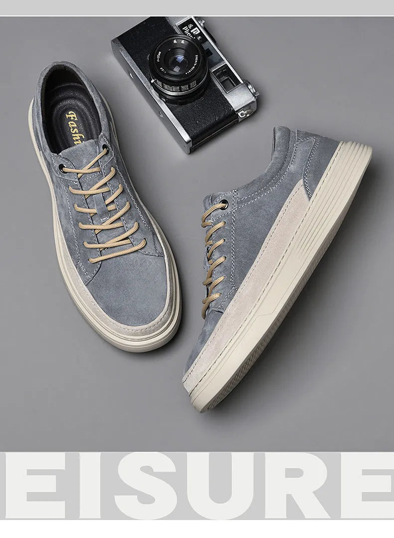 Men's grey casual leather skate shoes with round toe and lace-up front.