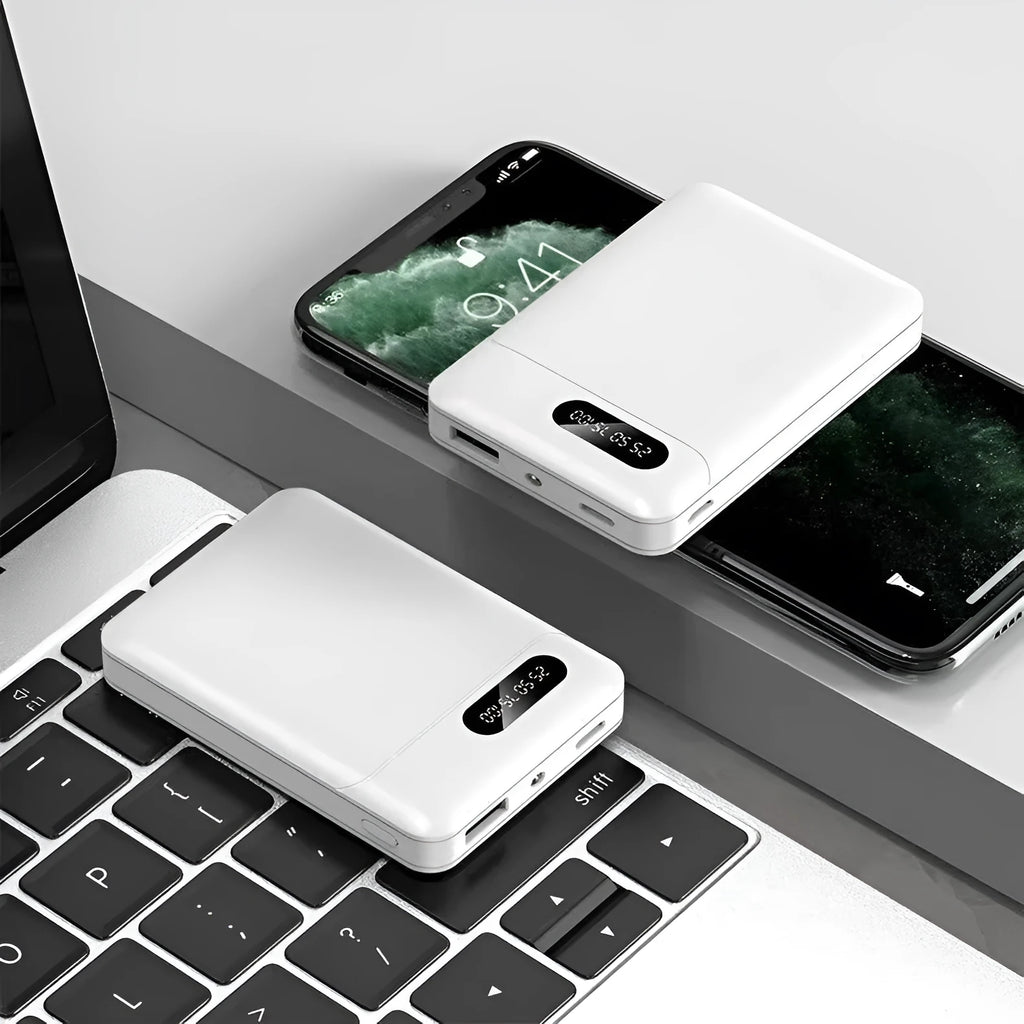 Black and white portable power bank with multiple capacity options and USB ports on a grey background.